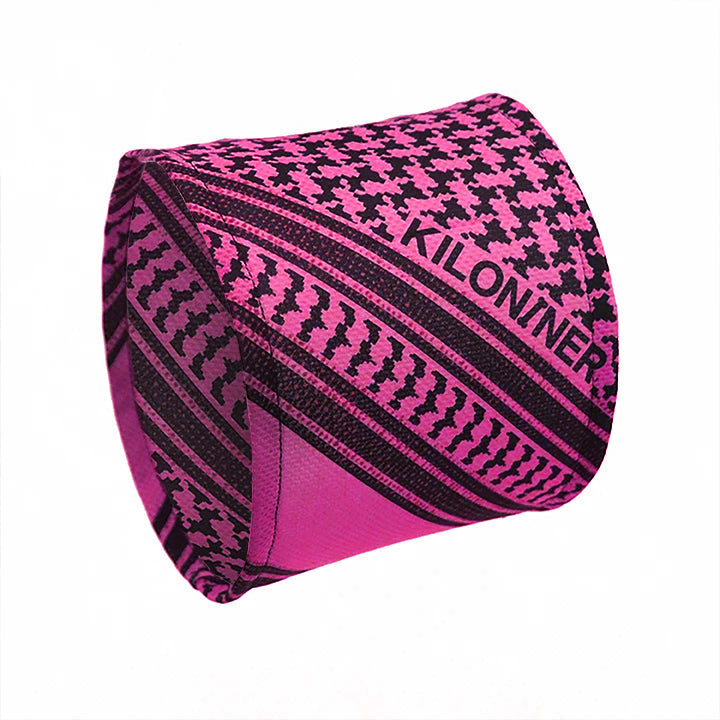 Pink and black patterned fabric with geometric designs and the word "KILONINER" on it.