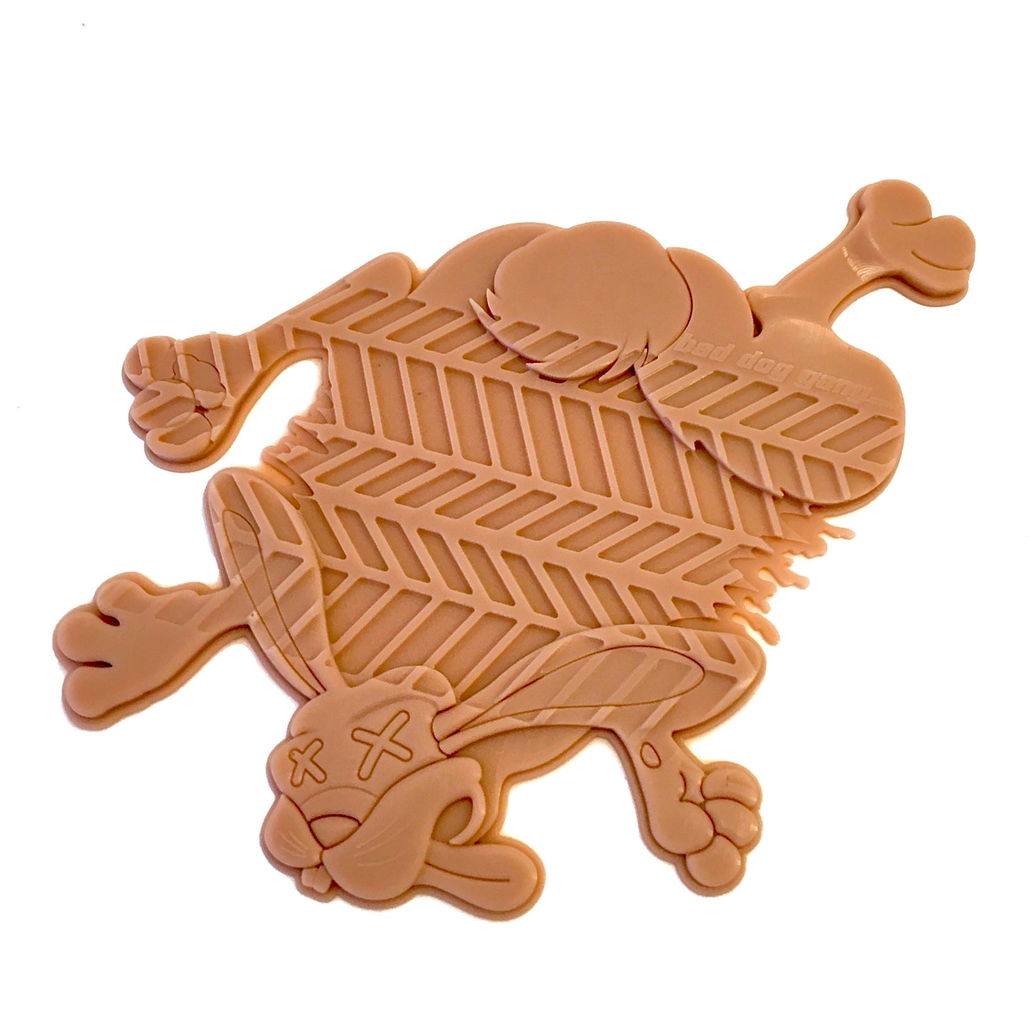 Flat, cartoonish, beige rubber mat shaped like a squashed animal with tire tread pattern.