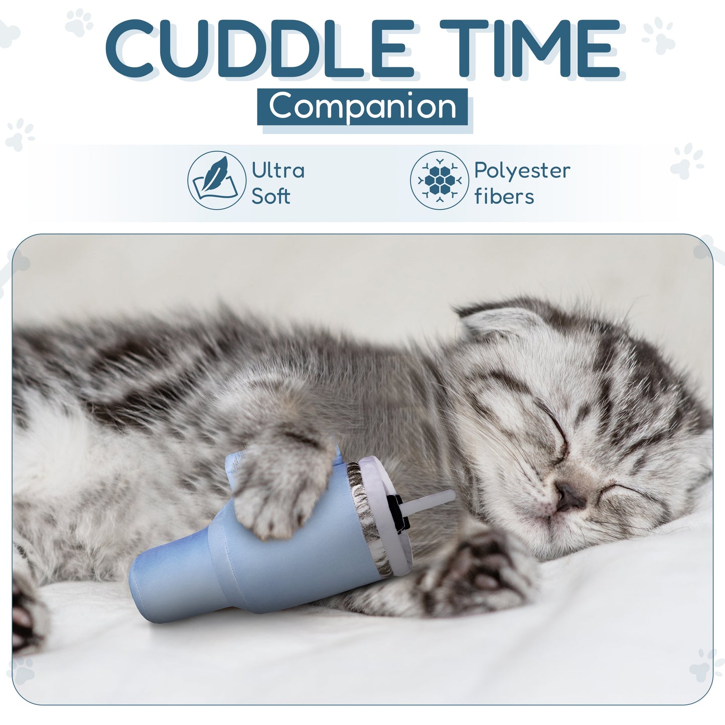 Sleeping gray kitten cuddling a blue plush toy on a white blanket.