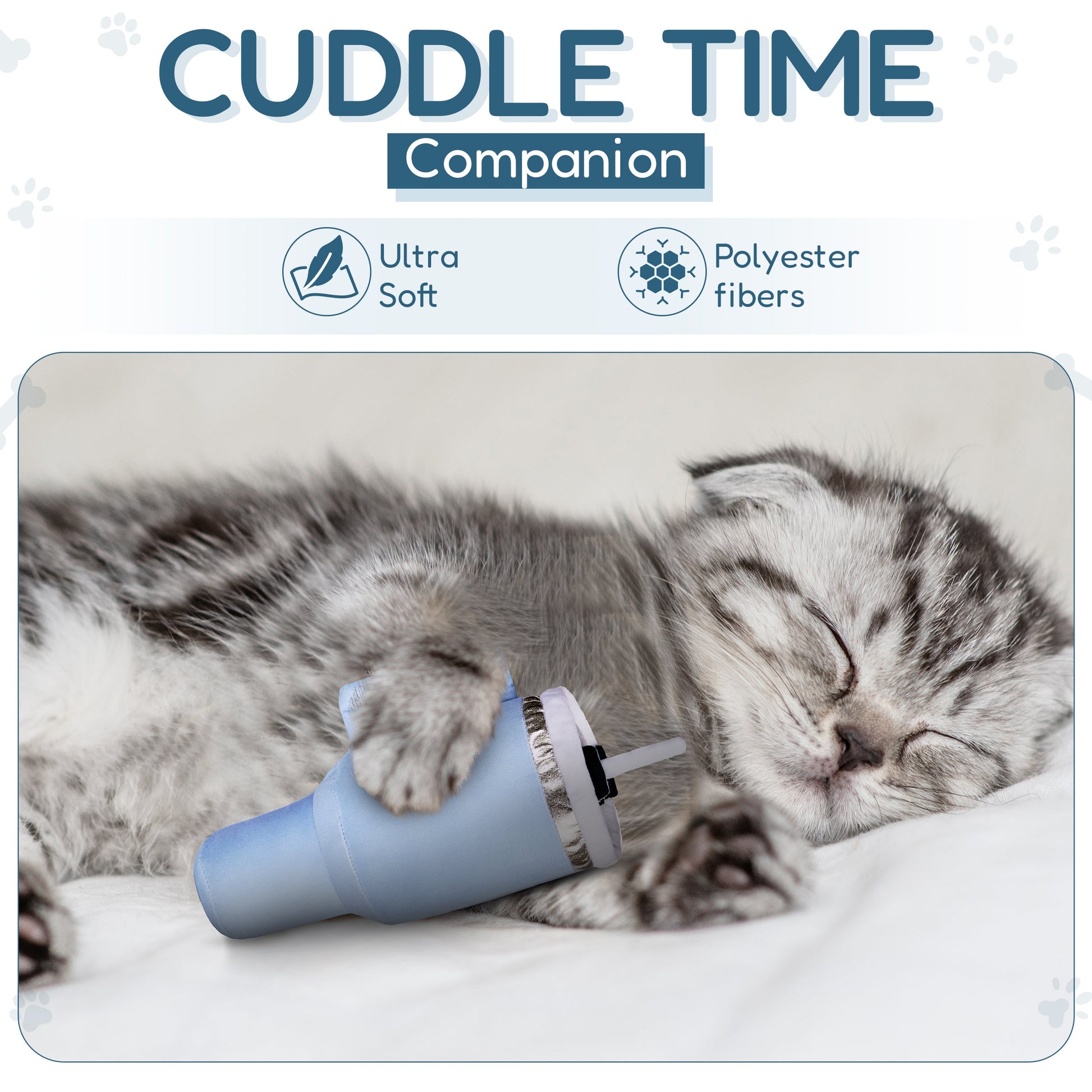Sleeping gray kitten cuddling a blue plush toy on a white blanket.