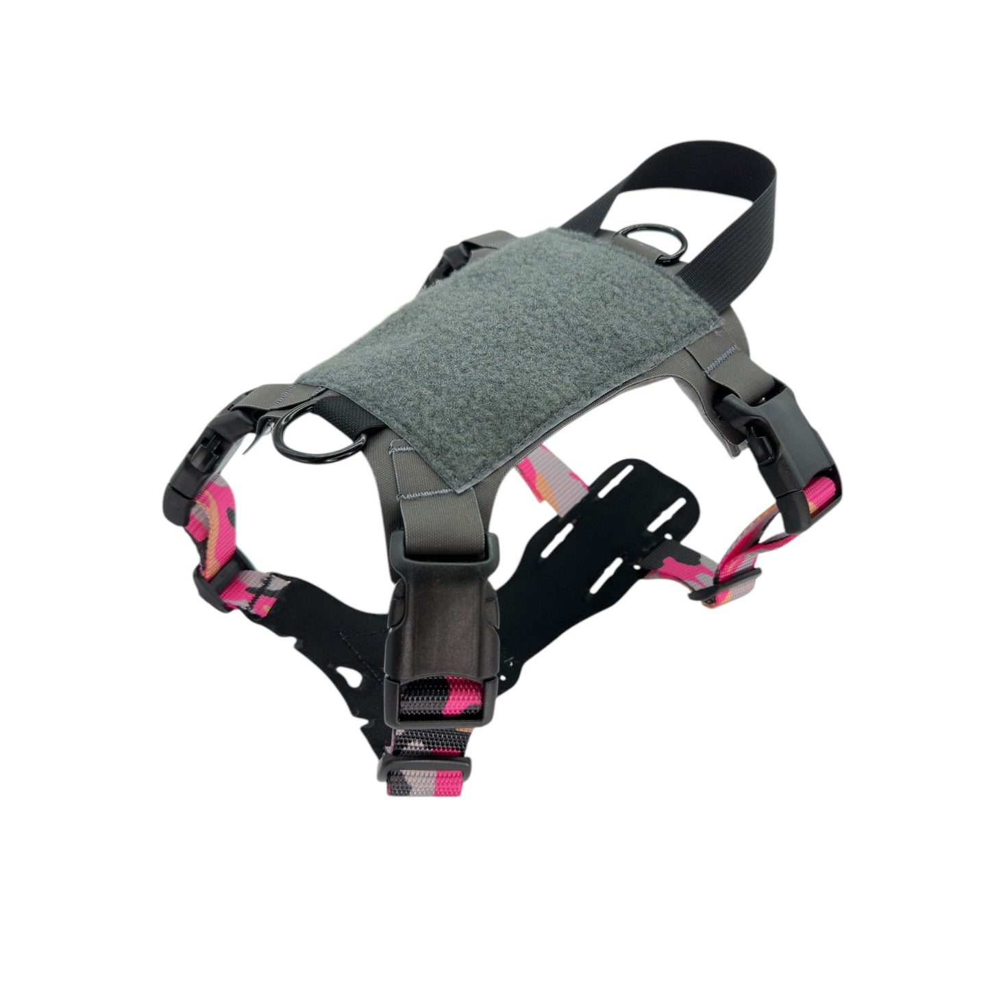 Gray and pink dog harness with adjustable straps, buckles, and a handle on top.
