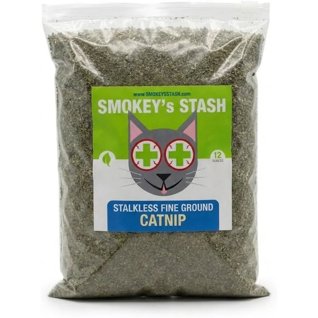 Clear bag of fine ground catnip with a green label featuring a cartoon cat face.
