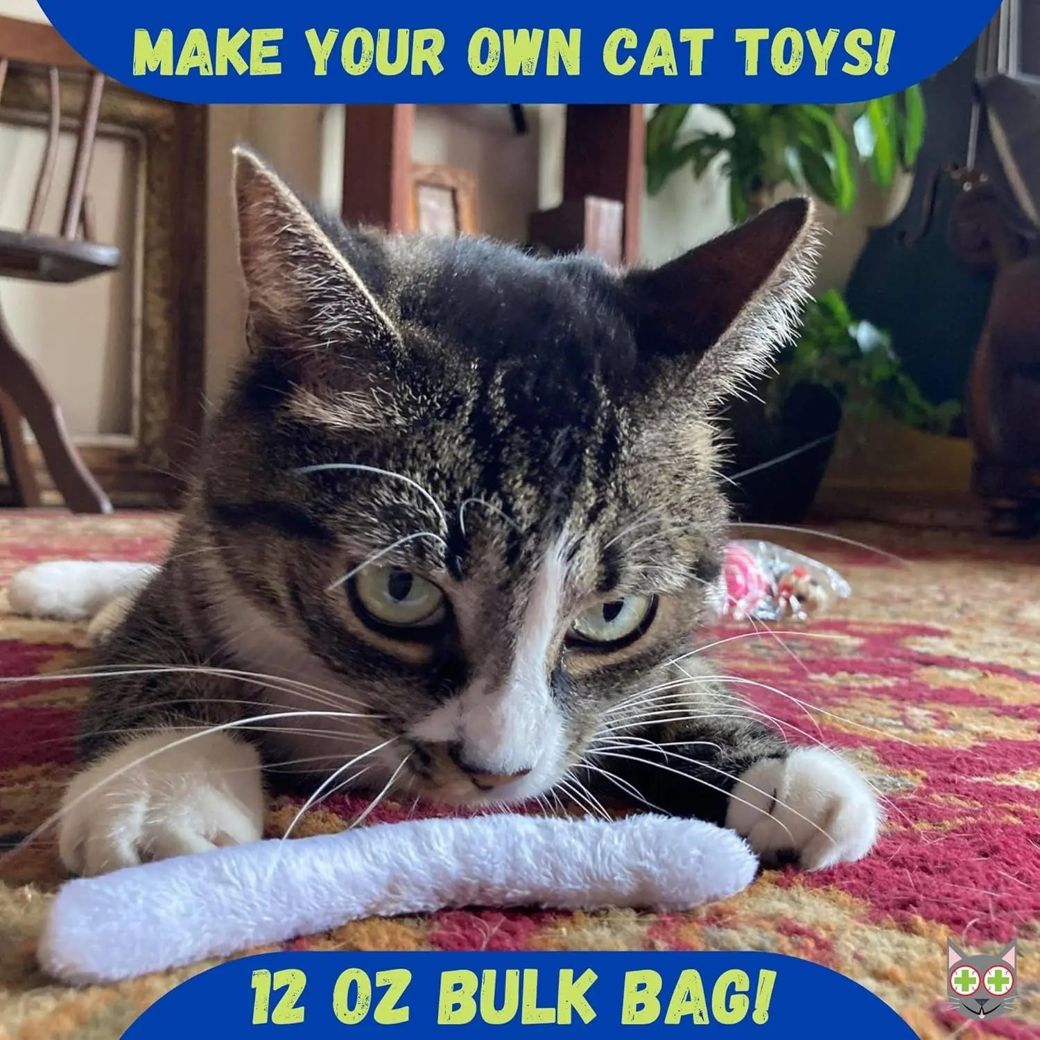 Cat on red carpet with white toy, text reads "Make Your Own Cat Toys! 12 oz Bulk Bag!"