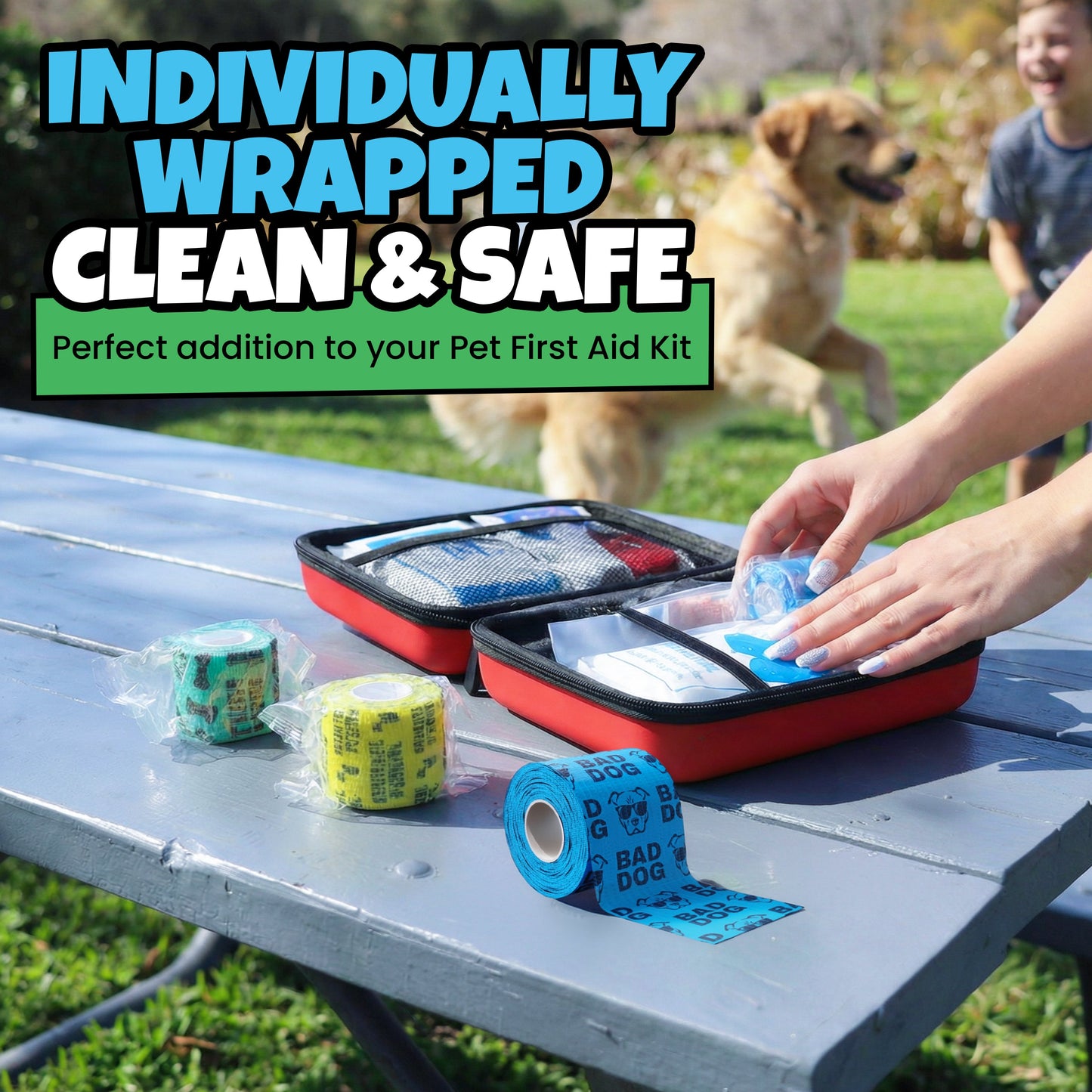 Pet first aid kit on a picnic table with colorful bandages; dog and child in the background.