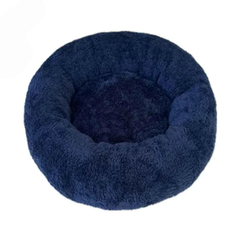 Round, fluffy dark blue pet bed with a soft, plush texture.