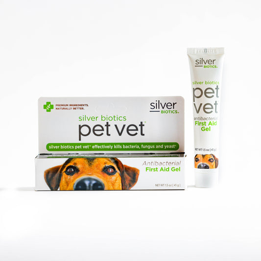 Pet Vet First Aid Gel box and tube with a dog's face, green accents, and white background.