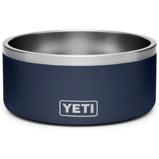 Dark blue metal bowl with silver rim and "YETI" logo on the side.