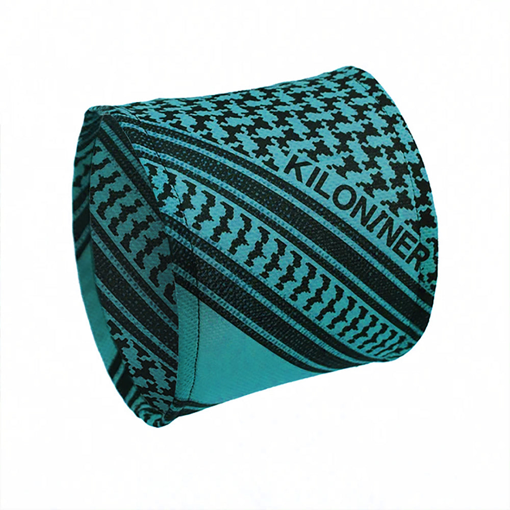 Teal and black patterned fabric with geometric designs and the word "KILONINER" in bold.